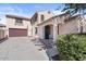 Two-story home boasts an attached garage, inviting entry, and manicured landscaping at 1708 W Seagull Ct, Chandler, AZ 85286