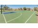 Community basketball court featuring modern equipment and ample space for recreational games at 18359 W Tina Ln, Surprise, AZ 85387