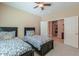 Bedroom featuring two twin beds, carpet flooring, and natural lighting with access to the hallway at 19 N Agua Fria Ln, Casa Grande, AZ 85194