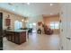 Open-concept kitchen and dining area with a large island and stainless steel appliances at 19 N Agua Fria Ln, Casa Grande, AZ 85194