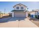 Two-story home with a two-car garage and a concrete driveway at 19437 N 43Rd Dr, Glendale, AZ 85308