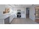 Updated kitchen featuring white cabinets, stainless steel appliances, and backyard access at 19437 N 43Rd Dr, Glendale, AZ 85308