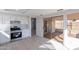 Open kitchen with white cabinets, stainless steel appliances, and tile floors at 19437 N 43Rd Dr, Glendale, AZ 85308