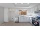 Modern kitchen with white cabinets, stainless steel appliances, and marble countertops at 19437 N 43Rd Dr, Glendale, AZ 85308