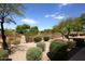 Private backyard with native landscaping and desert foliage, perfect for relaxation at 19475 N Grayhawk Dr # 1018, Scottsdale, AZ 85255