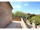 Spacious balcony with iron railing offering views of neighboring properties and lush foliage at 19475 N Grayhawk Dr # 1018, Scottsdale, AZ 85255