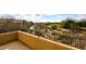 Balcony that overlooks desert landscaping, and a neighboring golf course at 19475 N Grayhawk Dr # 1018, Scottsdale, AZ 85255