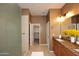 Bathroom with a walk-in shower, granite countertop, a well-lit mirror, and neutral wall tones at 19475 N Grayhawk Dr # 1018, Scottsdale, AZ 85255