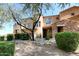 Attractive home exterior featuring a stone accent wall, desert landscaping, and a lovely entry at 19475 N Grayhawk Dr # 1018, Scottsdale, AZ 85255