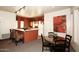 Cozy kitchen with breakfast bar, open layout, and adjacent dining area for easy entertaining at 19475 N Grayhawk Dr # 1018, Scottsdale, AZ 85255