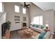 Bright living room with a vaulted ceiling, a cozy fireplace, and stylish furniture with blue accents at 19475 N Grayhawk Dr # 1018, Scottsdale, AZ 85255