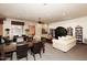 Spacious living room featuring plush sofas, built-in bookshelves, and ample seating for residents at 19475 N Grayhawk Dr # 1018, Scottsdale, AZ 85255