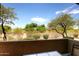 Scenic patio view featuring lush green trees and clear blue skies, offering a peaceful outdoor experience at 19475 N Grayhawk Dr # 1018, Scottsdale, AZ 85255