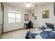 Bright bedroom with a ceiling fan, a bed, and comic book decor at 20493 E Thornton Rd, Queen Creek, AZ 85142