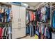 Spacious walk-in closet with custom shelving and ample storage space at 20493 E Thornton Rd, Queen Creek, AZ 85142