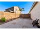 Spacious backyard with block wall, patio, and easy-care desert landscaping at 21244 E Creekside Dr, Queen Creek, AZ 85142