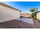 Large backyard with patio and desert landscaping, perfect for outdoor activities at 21244 E Creekside Dr, Queen Creek, AZ 85142