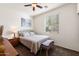 Comfortable bedroom with a ceiling fan and bright natural light at 21244 E Creekside Dr, Queen Creek, AZ 85142