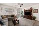 Cozy living room with a plush sofa and media center with large television at 21244 E Creekside Dr, Queen Creek, AZ 85142