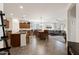 Open concept living space with a dining area, kitchen island, and a comfortable living room at 21244 E Creekside Dr, Queen Creek, AZ 85142