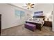 This main bedroom boasts a ceiling fan, natural light, and stylish decor at 21244 E Creekside Dr, Queen Creek, AZ 85142