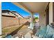 Charming covered patio with comfortable seating area and view of the backyard at 21244 E Creekside Dr, Queen Creek, AZ 85142