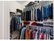 Spacious walk-in closet with ample hanging and shelf storage at 21244 E Creekside Dr, Queen Creek, AZ 85142