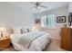 Comfortable bedroom with a ceiling fan, neutral decor, and a window with shutter-style blinds at 22181 N 78Th St, Scottsdale, AZ 85255