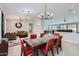 Bright dining room with stylish lighting, modern furniture, and tile floors at 22181 N 78Th St, Scottsdale, AZ 85255