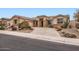 Charming home with desert landscaping, stone accents, and a tile roof at 22181 N 78Th St, Scottsdale, AZ 85255