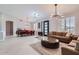 Open-concept living room with modern lighting, plantation shutters, and neutral decor at 22181 N 78Th St, Scottsdale, AZ 85255