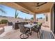 Beautiful outdoor patio with dining and lounge seating, built in grill, and views of the well-kept yard at 22181 N 78Th St, Scottsdale, AZ 85255