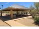 Community picnic area with multiple tables and a large shade structure, perfect for gatherings at 22181 N 78Th St, Scottsdale, AZ 85255