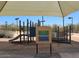 Community playground including accessible ramps, slide and play features, all covered by a shade canopy at 22181 N 78Th St, Scottsdale, AZ 85255