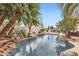 Private backyard pool with lush landscaping and a waterfall feature for ultimate relaxation at 22181 N 78Th St, Scottsdale, AZ 85255