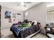 Teenage bedroom with a drum set, posters, desk, and large plush toys on the bed at 22452 E Calle De Flores --, Queen Creek, AZ 85142