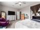 Neutral bedroom offers a nice dresser, TV, and an en suite bathroom at 22452 E Calle De Flores --, Queen Creek, AZ 85142