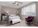 Cozy bedroom with soft carpet, a ceiling fan, and natural light from a window at 22452 E Calle De Flores --, Queen Creek, AZ 85142