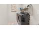 Well-lit laundry room featuring gray, front-loading washer and dryer at 23103 E Mewes Rd, Queen Creek, AZ 85142