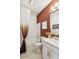 Well-lit bathroom featuring a marble tiled shower and tub, vanity with sleek white countertops, and stylish fixtures at 23435 W Albeniz Pl, Buckeye, AZ 85326