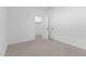 A bright bedroom has neutral carpet and a white door leading to the closet at 23435 W Albeniz Pl, Buckeye, AZ 85326