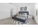 Stylishly staged bedroom with a plush bed, neutral carpet and soothing wall decor at 23435 W Albeniz Pl, Buckeye, AZ 85326