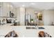 Modern kitchen featuring stainless steel appliances, white countertops, and ample cabinet space at 23435 W Albeniz Pl, Buckeye, AZ 85326