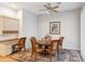 Cozy eat-in kitchen area features a chandelier, ceiling fan, and modern appliances at 23702 S Desert Sands Dr, Sun Lakes, AZ 85248