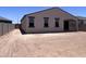 Spacious backyard with room for outdoor activities and future landscaping, plus view of the home's rear exterior at 24080 W Bowker St, Buckeye, AZ 85326
