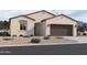 Charming single-story home featuring a two-car garage and low-maintenance desert landscaping at 24080 W Bowker St, Buckeye, AZ 85326