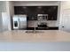 Bright kitchen showcases stainless appliances, white countertops, and a large island sink at 24080 W Bowker St, Buckeye, AZ 85326