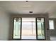 Bright living space with large sliding glass doors creating seamless indoor-outdoor living; under construction at 24080 W Bowker St, Buckeye, AZ 85326