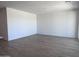 Spacious living room features modern tile flooring, ample lighting, and neutral paint at 24080 W Bowker St, Buckeye, AZ 85326