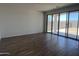 Bright living room boasts tile flooring and sliding glass doors to the backyard at 24080 W Bowker St, Buckeye, AZ 85326